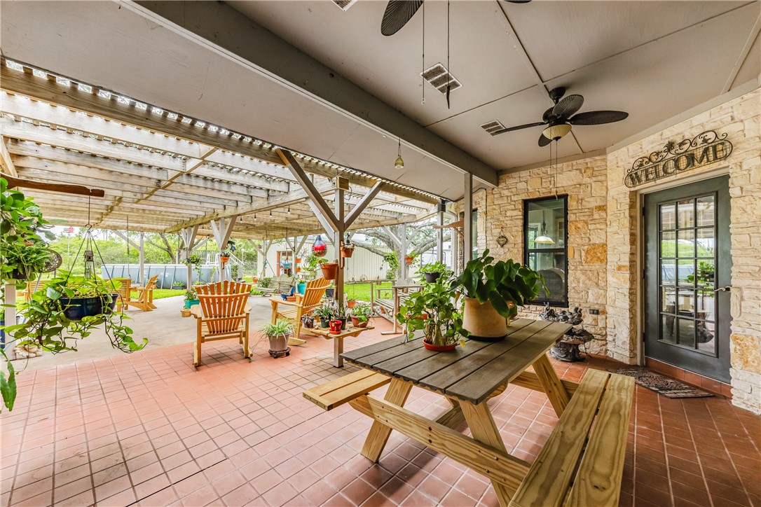 345 Trail Ridge Drive Sandia, TX 78383 - Photo 13 of 40 a building outdoor space with patio furniture and potted plants
