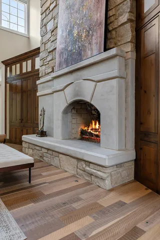 a kitchen with cabinets and chairs