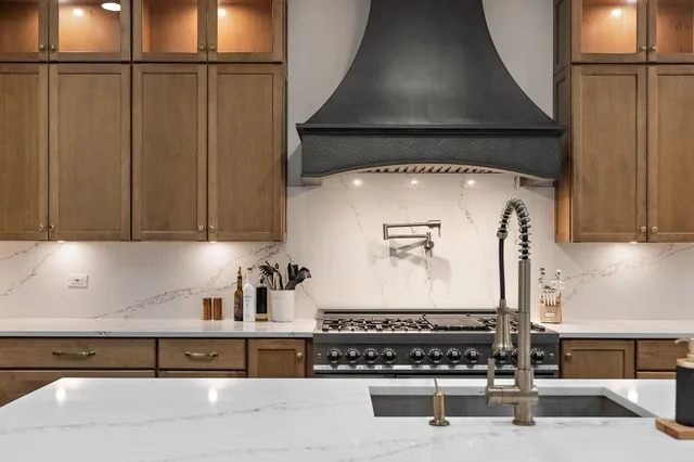 a kitchen with a sink cabinets and appliances