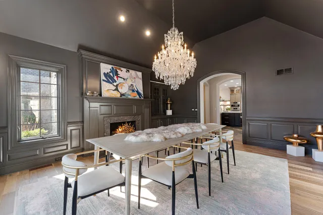 a kitchen with a table and chairs