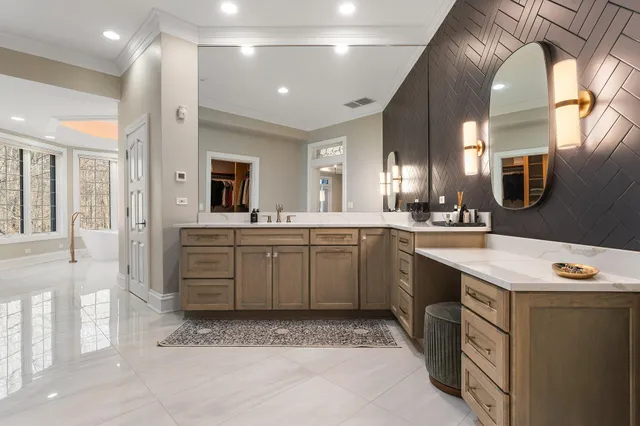 a view of an empty room with a fireplace and a window