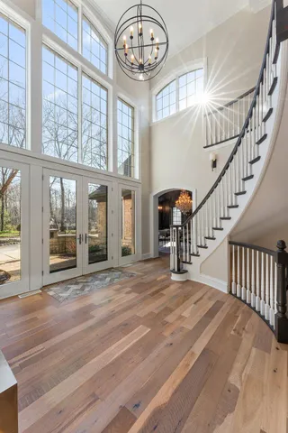a living room with furniture ceiling fan and a table