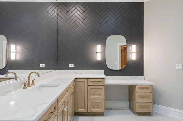 a bathroom with a double vanity sink and a mirror