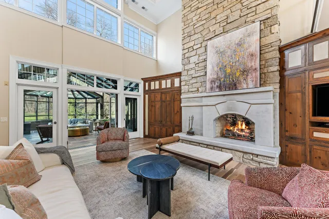a view of a hall way with furniture and staircase