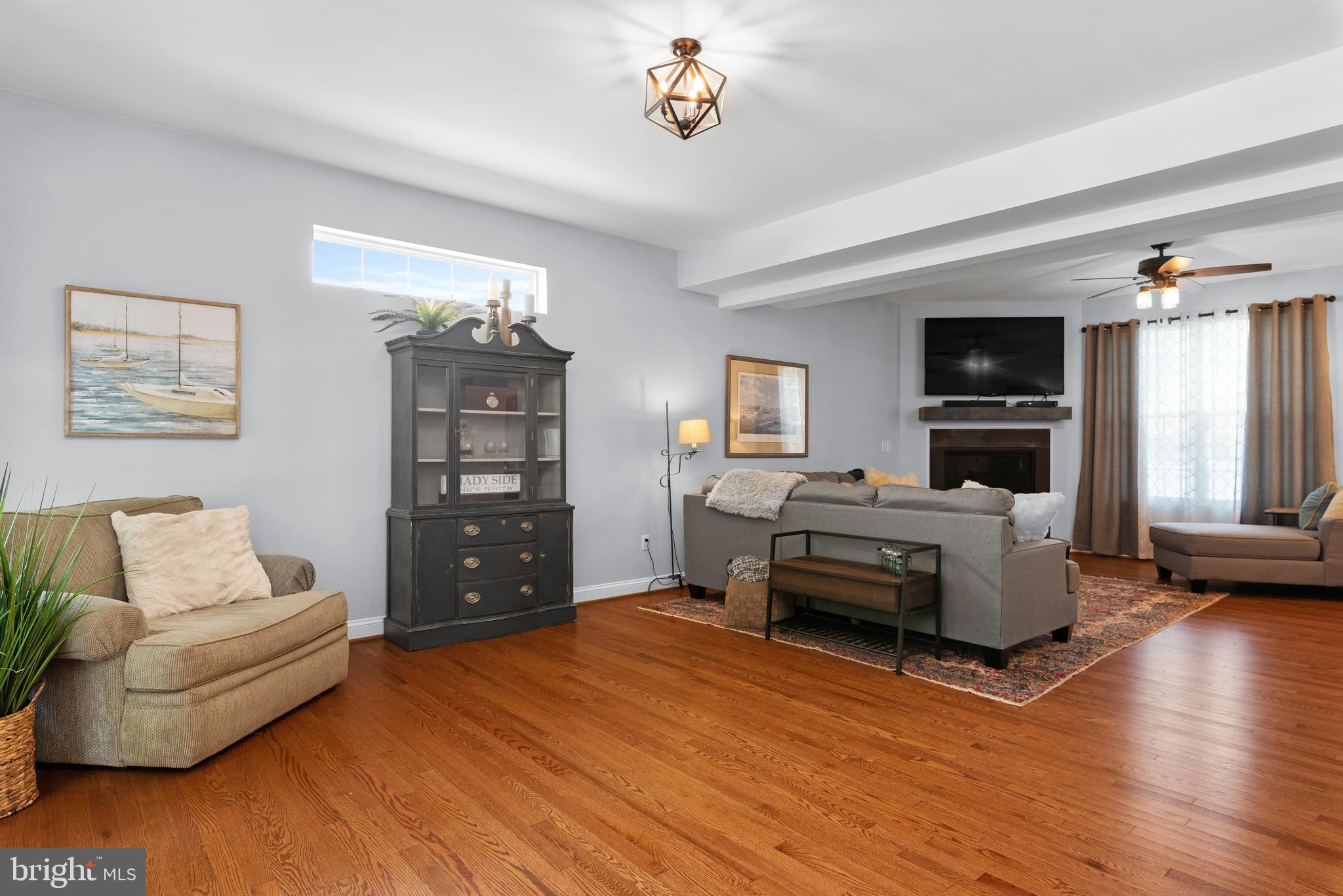 1305 Steamboat Road Shady Side, MD 20764 - Photo 6 of 40 Wood flooring gleams in the living area