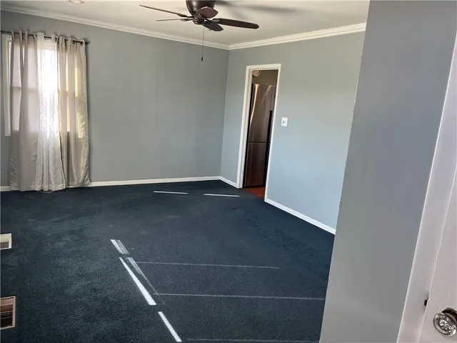 a view of a livingroom with a staircase