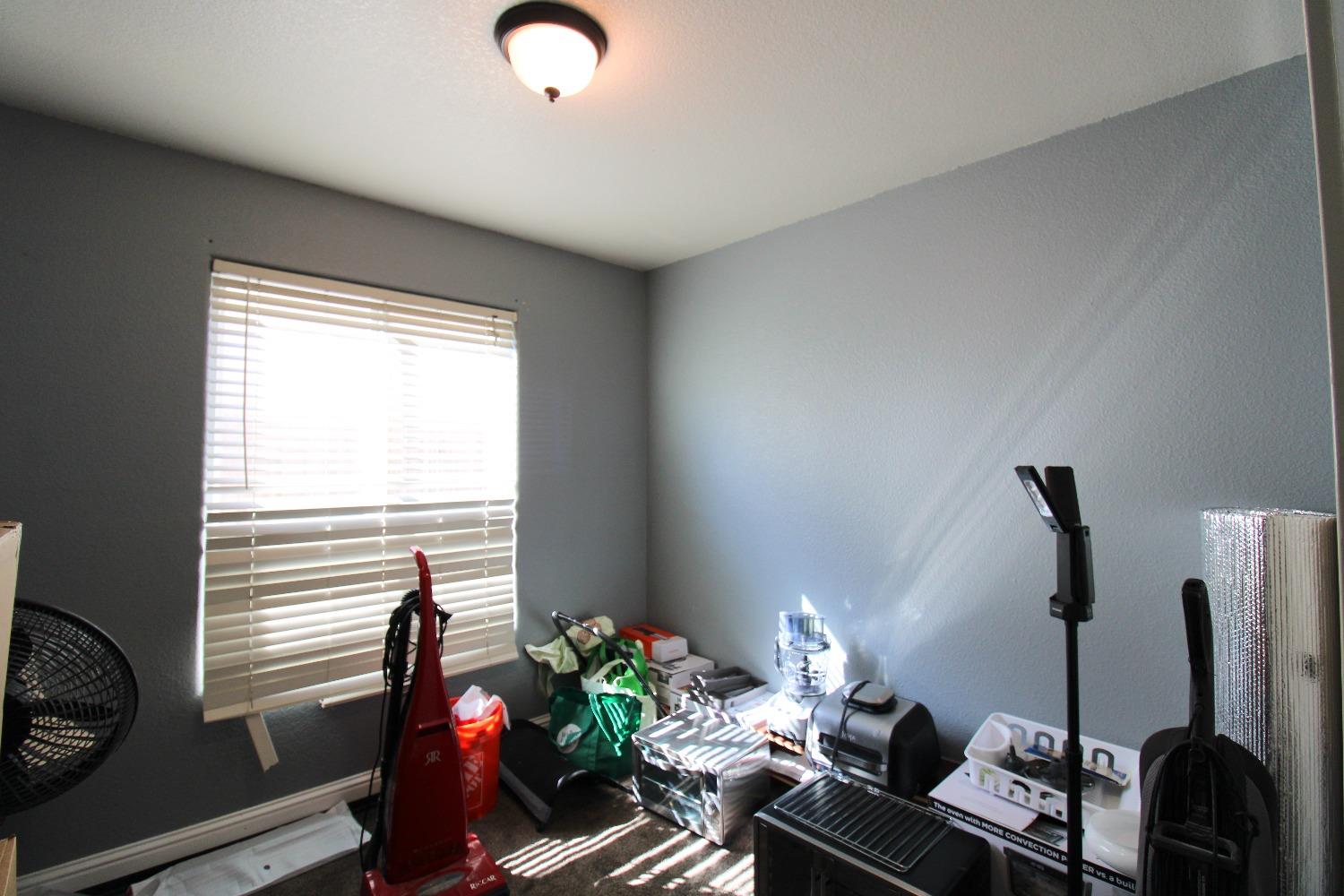 554 St Michelle Drive Madera, CA 93637 - Photo 12 of 19 a living room with furniture and a window