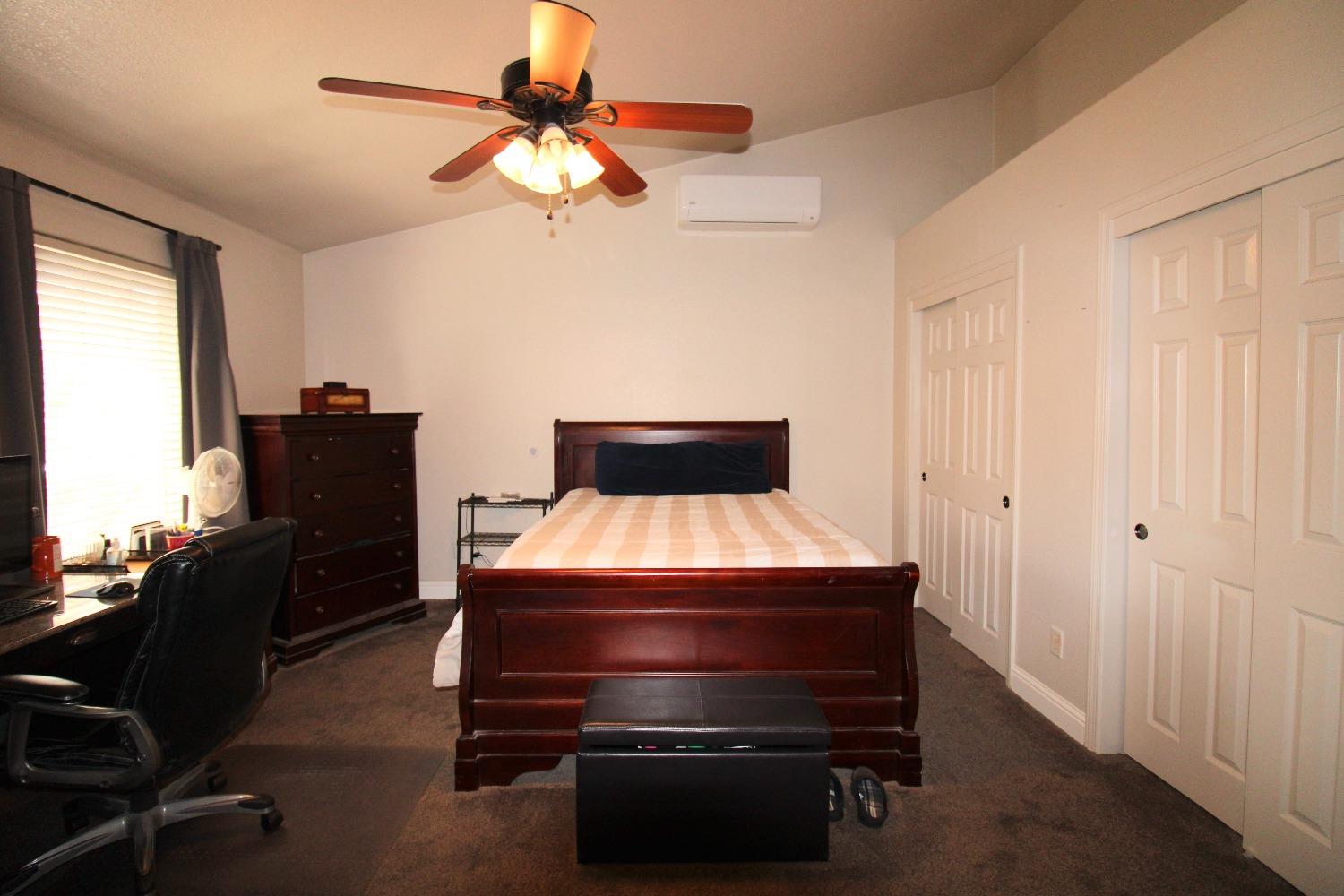 554 St Michelle Drive Madera, CA 93637 - Photo 16 of 19 a room with furniture and wooden floor