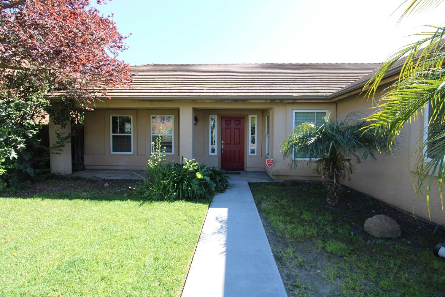 554 St Michelle Drive Madera, CA 93637 - Photo 4 of 19 a front view of a house with garden