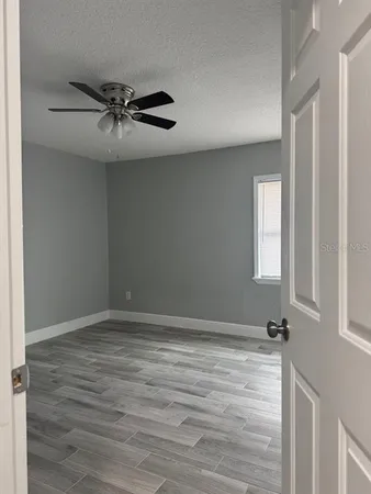 a view of an empty room with a window
