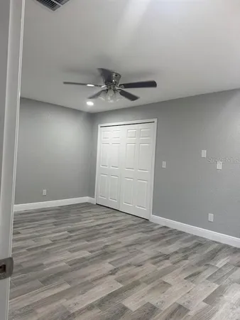 a view of an empty room with a window