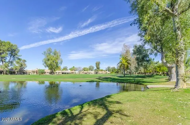 a view of a lake with a big yard