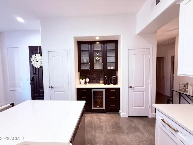 a kitchen with stainless steel appliances kitchen island sink refrigerator and stove