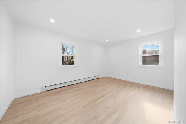 a bathroom with a sink a toilet a shower and a mirror