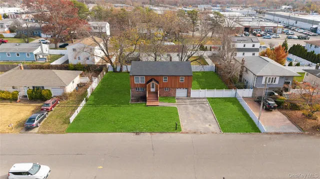 a view of a backyard with large tree