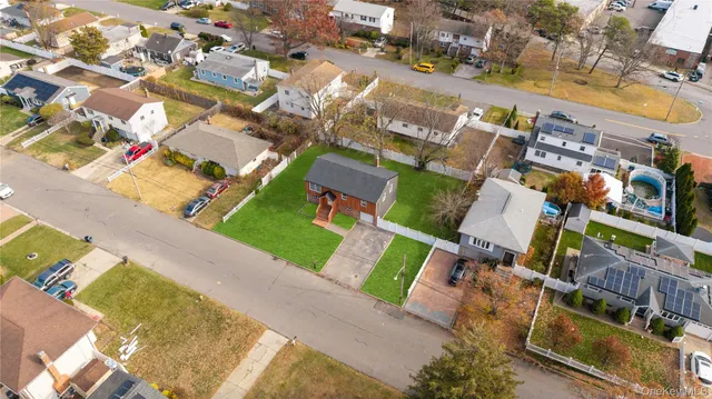 an aerial view of residential houses with outdoor space