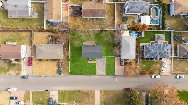 an aerial view of a house with a swimming pool