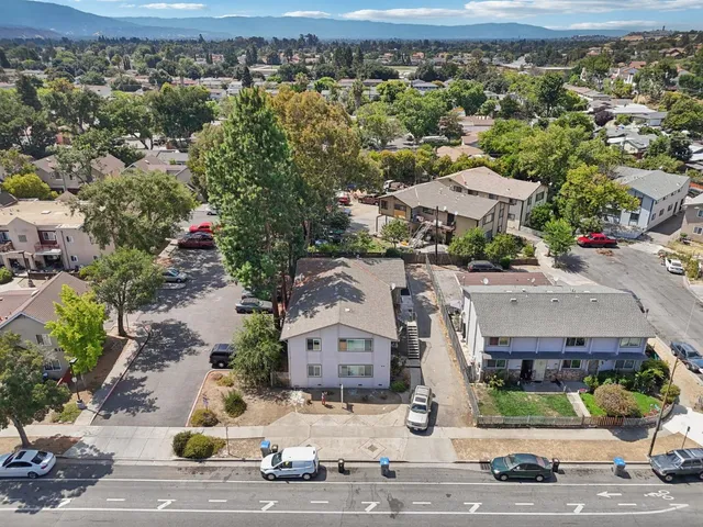 an aerial view of residential houses with outdoor space