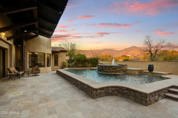 a view of a backyard with sitting area