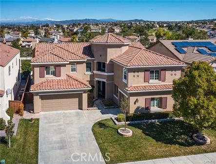 45344 St Tisbury Street Temecula, CA 92592 - Photo 1 of 1 a front view of a house with a yard