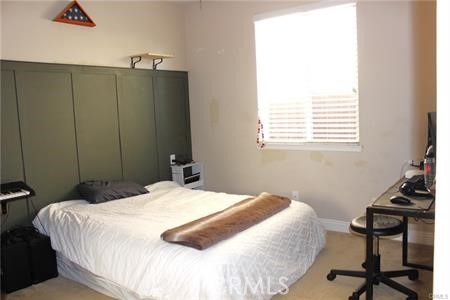 45344 St Tisbury Street Temecula, CA 92592 - Photo 11 of 28 a bedroom with a bed and a desk