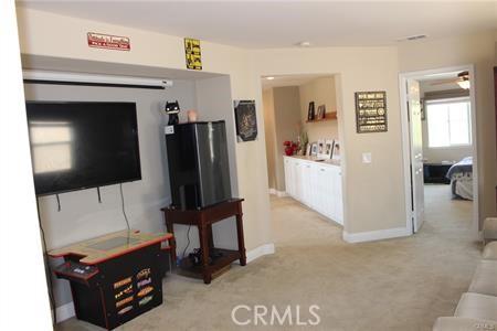 45344 St Tisbury Street Temecula, CA 92592 - Photo 20 of 28 a living room with furniture and a flat screen tv