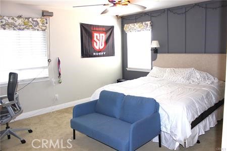 45344 St Tisbury Street Temecula, CA 92592 - Photo 21 of 28 a bedroom with a bed and a flat screen tv