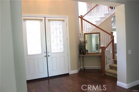 45344 St Tisbury Street Temecula, CA 92592 - Photo 3 of 28 a view of entryway and hall with wooden floor