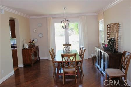 45344 St Tisbury Street Temecula, CA 92592 - Photo 9 of 28 a view of a dining room with furniture window and wooden floor