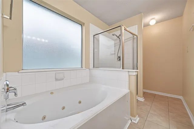 a bathroom with a double vanity sink and mirror