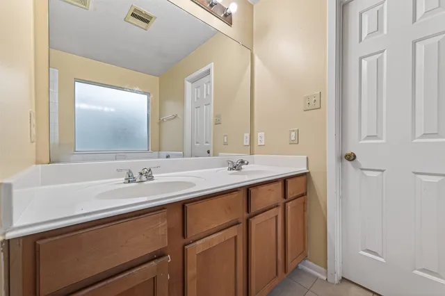 a bathroom with a bathtub and a sink