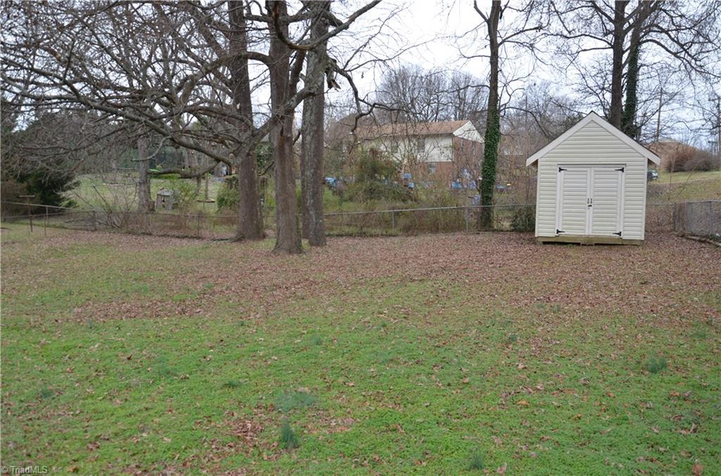 1631 Larkin Street High Point, NC 27262 - Photo 9 of 17 Nice, huge, fenced backyard with storage building.