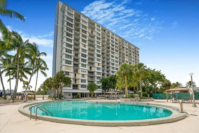 a view of swimming pool with outdoor seating