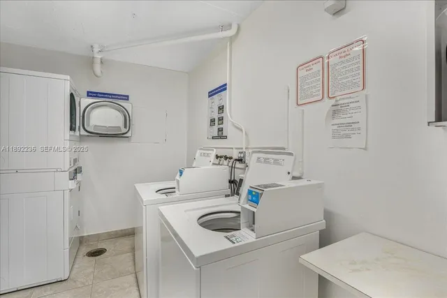 a bathroom with a sink and a washer dryer