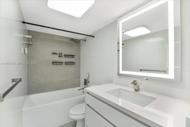 a bathroom with a sink a toilet and a bathtub