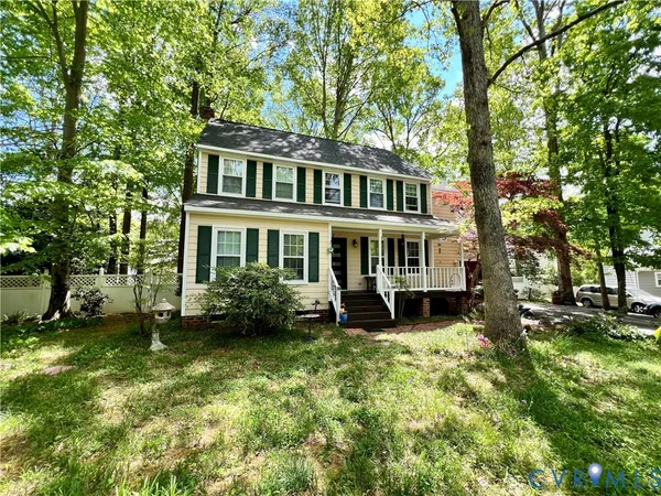 a view of a house with a yard porch and sitting area