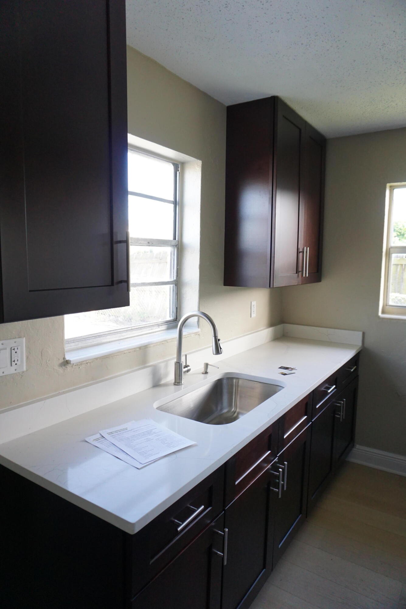 1601 West 37th Street, Unit 6 Riviera Beach, FL 33404 - Photo 1 of 12 a bathroom with a sink and a mirror