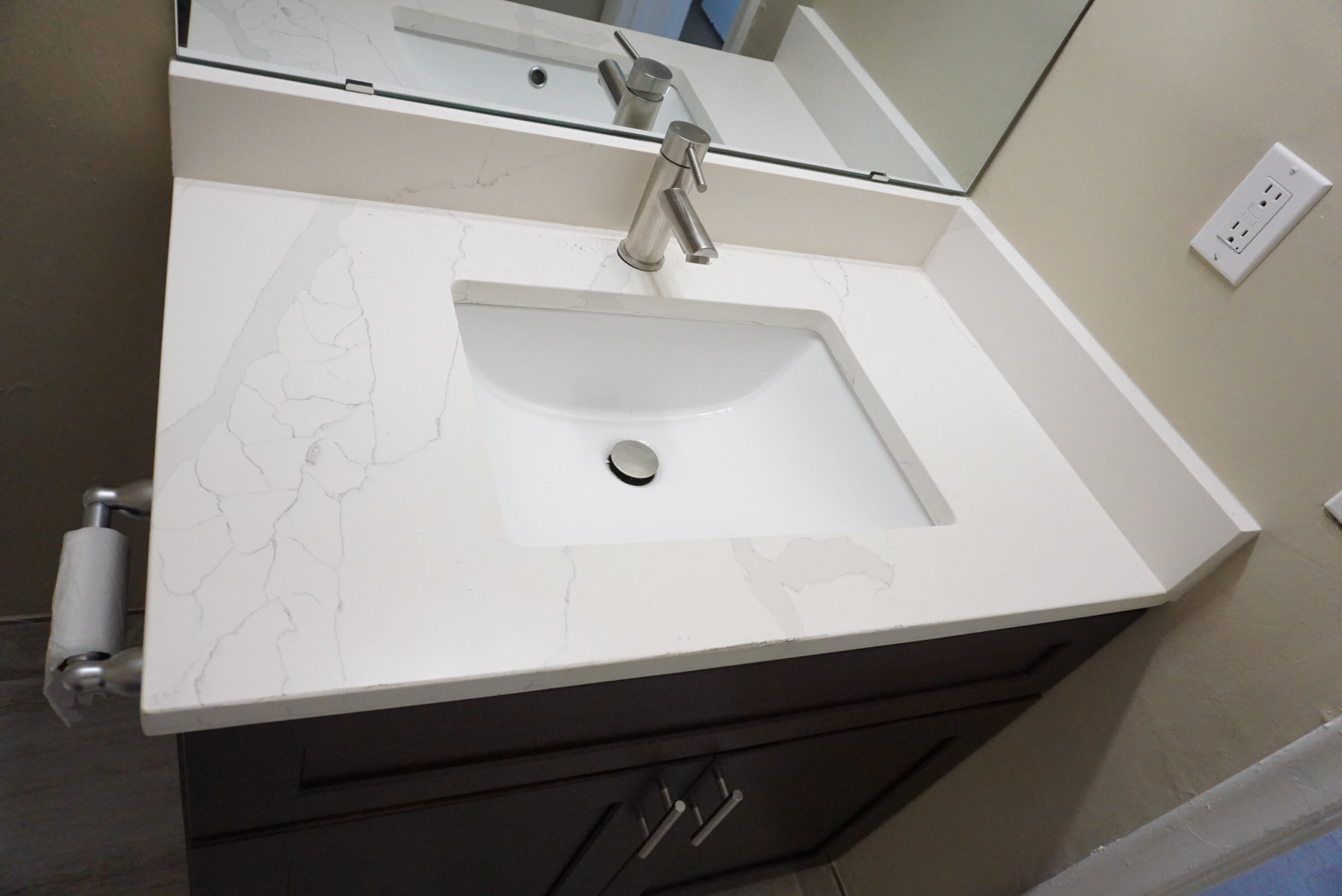 1601 West 37th Street, Unit 6 Riviera Beach, FL 33404 - Photo 8 of 12 a close view of a sink in the bathroom