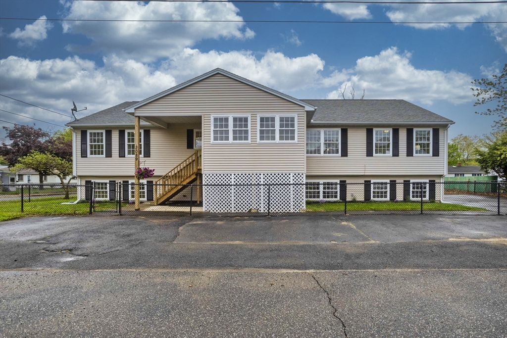 2089 Oak Street Three Rivers, MA 01080 - Photo 1 of 42 a front view of a house with a yard and garage