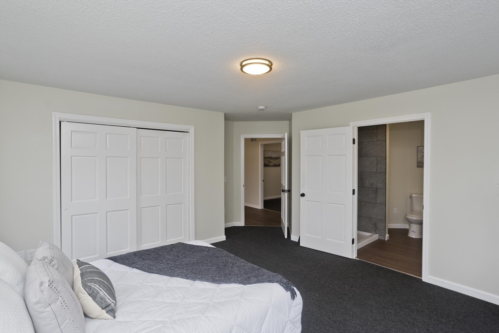 2089 Oak Street Three Rivers, MA 01080 - Photo 12 of 42 a bedroom with a bed and a window