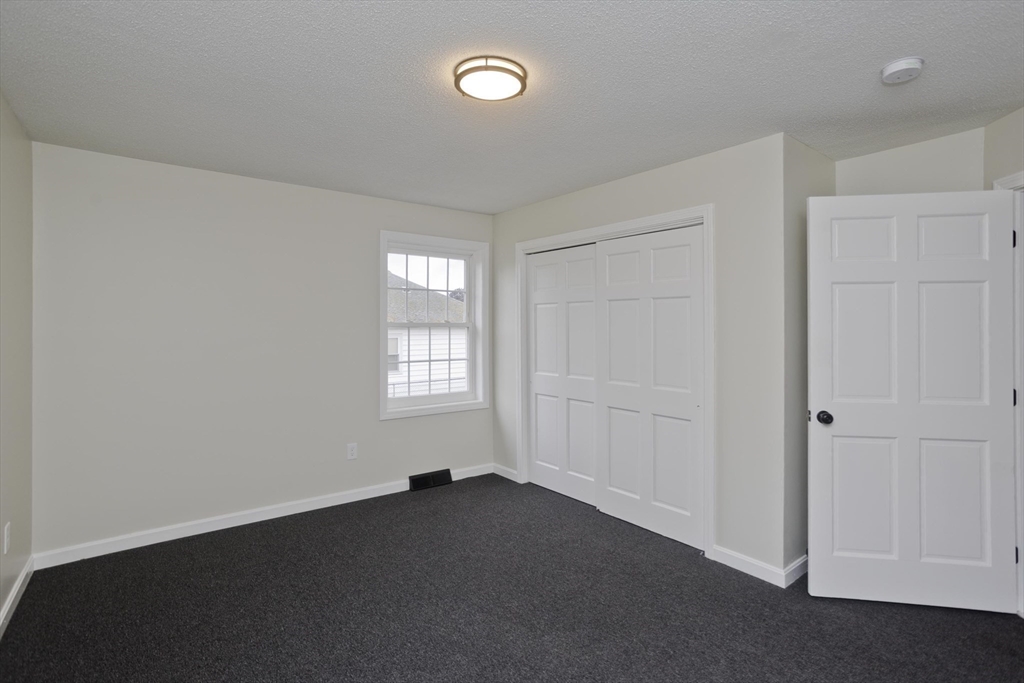 2089 Oak Street Three Rivers, MA 01080 - Photo 18 of 42 an empty room with windows