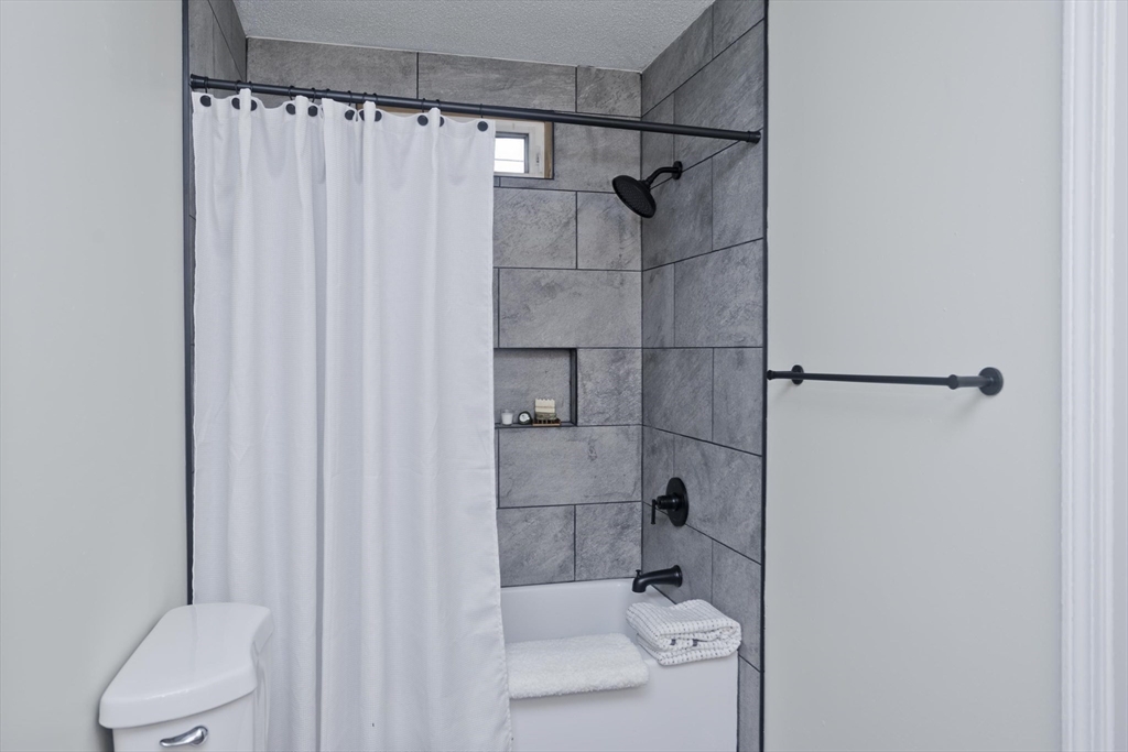 2089 Oak Street Three Rivers, MA 01080 - Photo 25 of 42 a bathroom with a shower and toilet