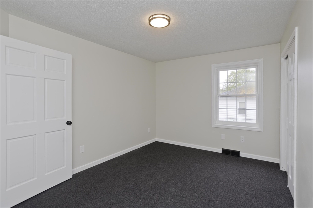 2089 Oak Street Three Rivers, MA 01080 - Photo 27 of 42 an empty room with a window