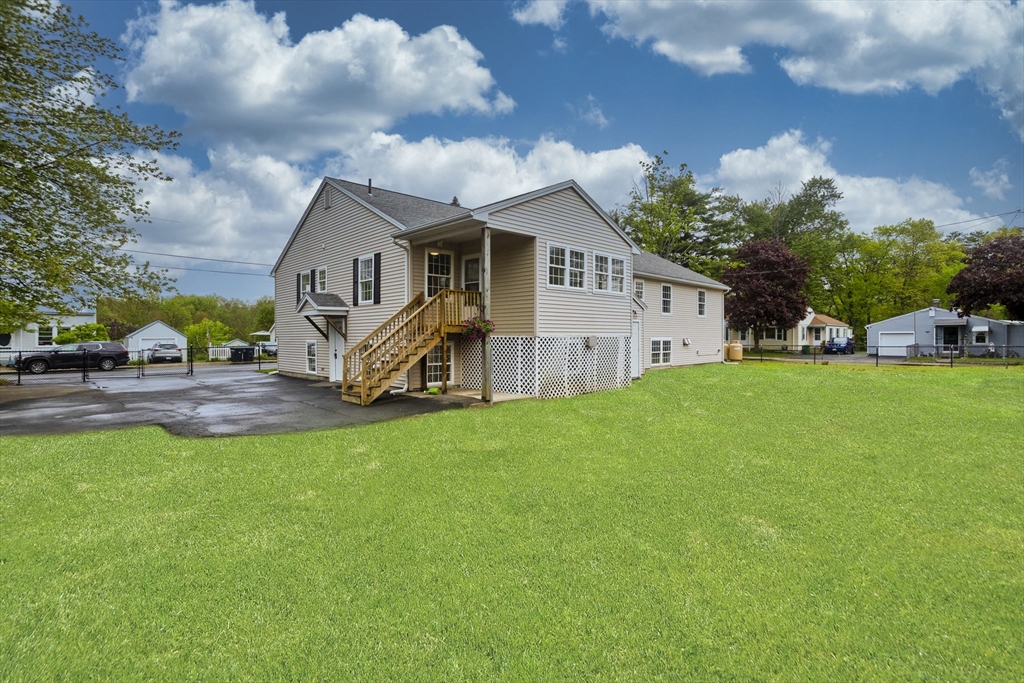 2089 Oak Street Three Rivers, MA 01080 - Photo 42 of 42 a front view of house with yard and green space