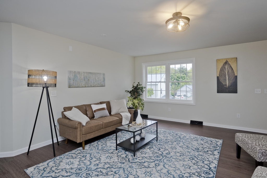 2089 Oak Street Three Rivers, MA 01080 - Photo 10 of 42 a living room with furniture and a rug