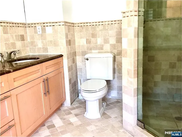 a garden with flowers and a table