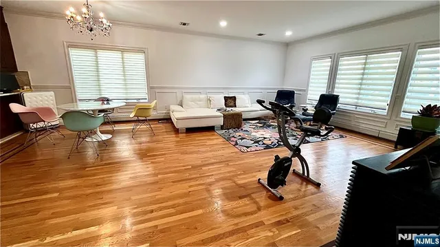 a kitchen with stainless steel appliances a sink stove and cabinets