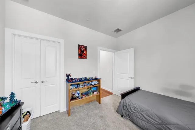 a bedroom with furniture and a wooden floor