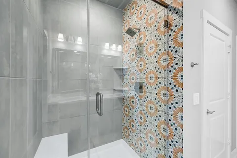 a bathroom with a sink double vanity and a mirror