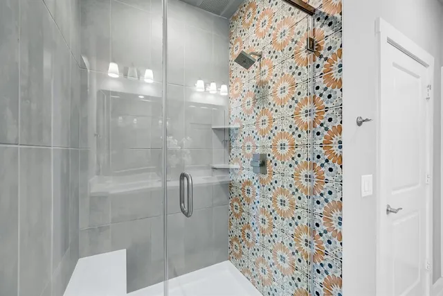 a bathroom with a sink double vanity and a mirror